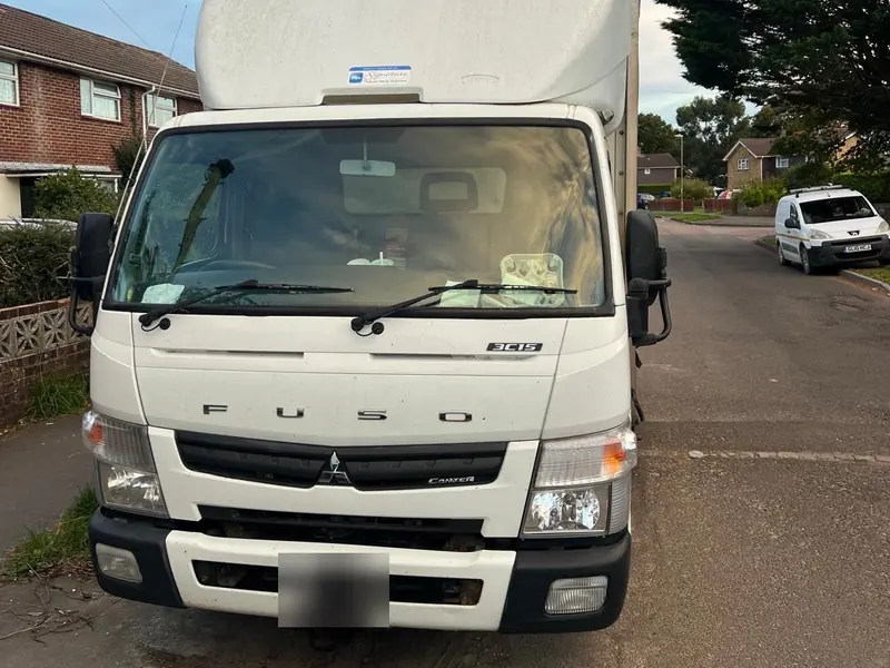Our white Fuso removal truck parked on a residential street
